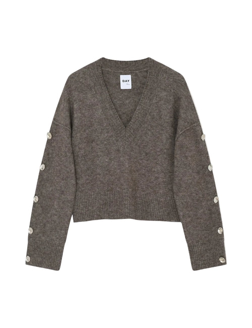 Gray sweater with button details on a white background