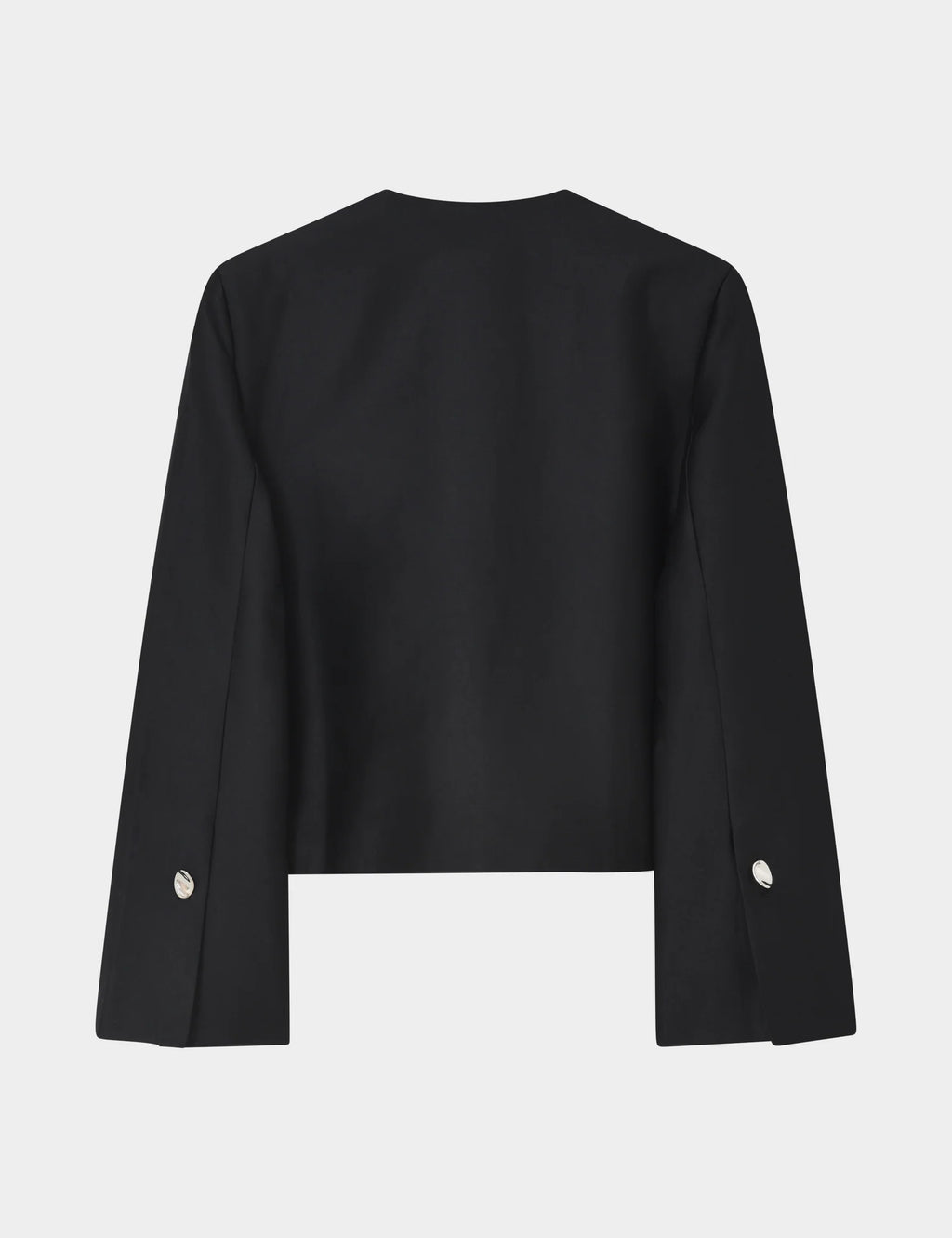 Black jacket with silver buttons on a light gray background