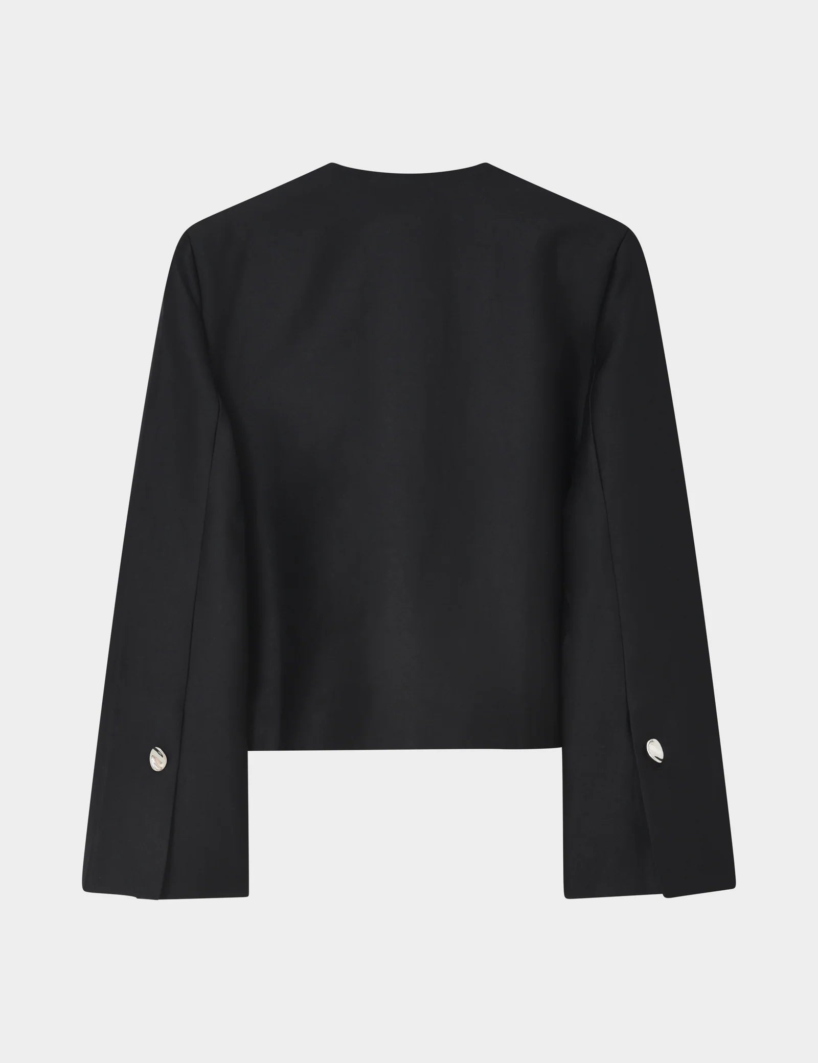 Black jacket with silver buttons on a light gray background