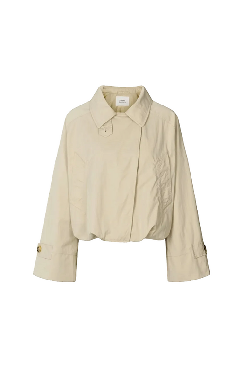 A cropped beige trench jacket with a pointed collar, long sleeves, and button details on the cuffs, shown against a plain white background.