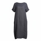 A dark gray short-sleeve linen dress with a relaxed, loose fit and side pockets, shown against a plain white background.