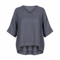 A slate gray short-sleeve V-neck top with a relaxed, oversized fit and a slightly asymmetrical hem, shown against a plain white background.