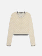 Beige sweater with black trim on a white background