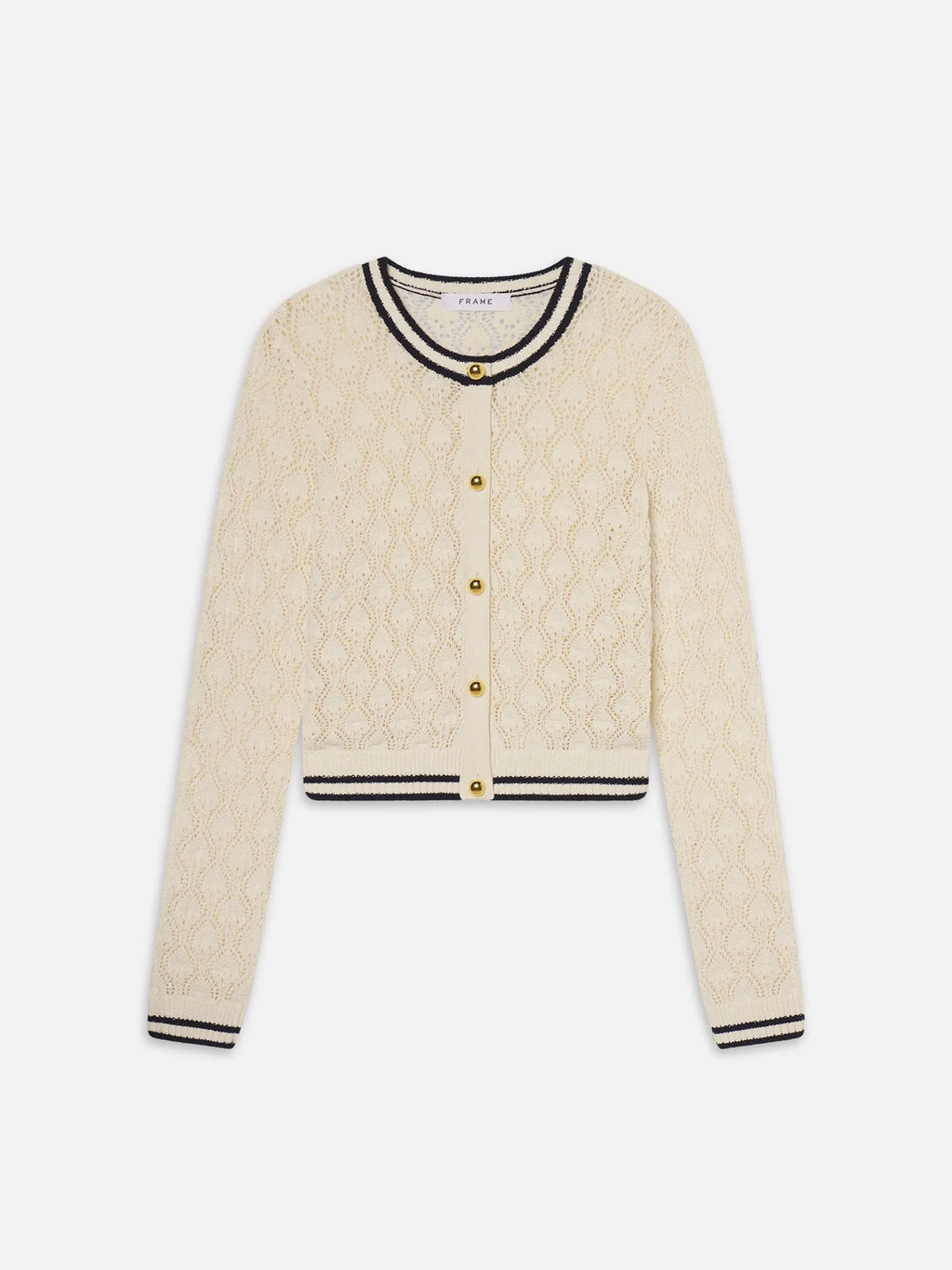 Beige cardigan with black trim on a white background