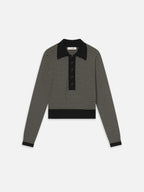 Black and white striped sweater with a collar on a white background