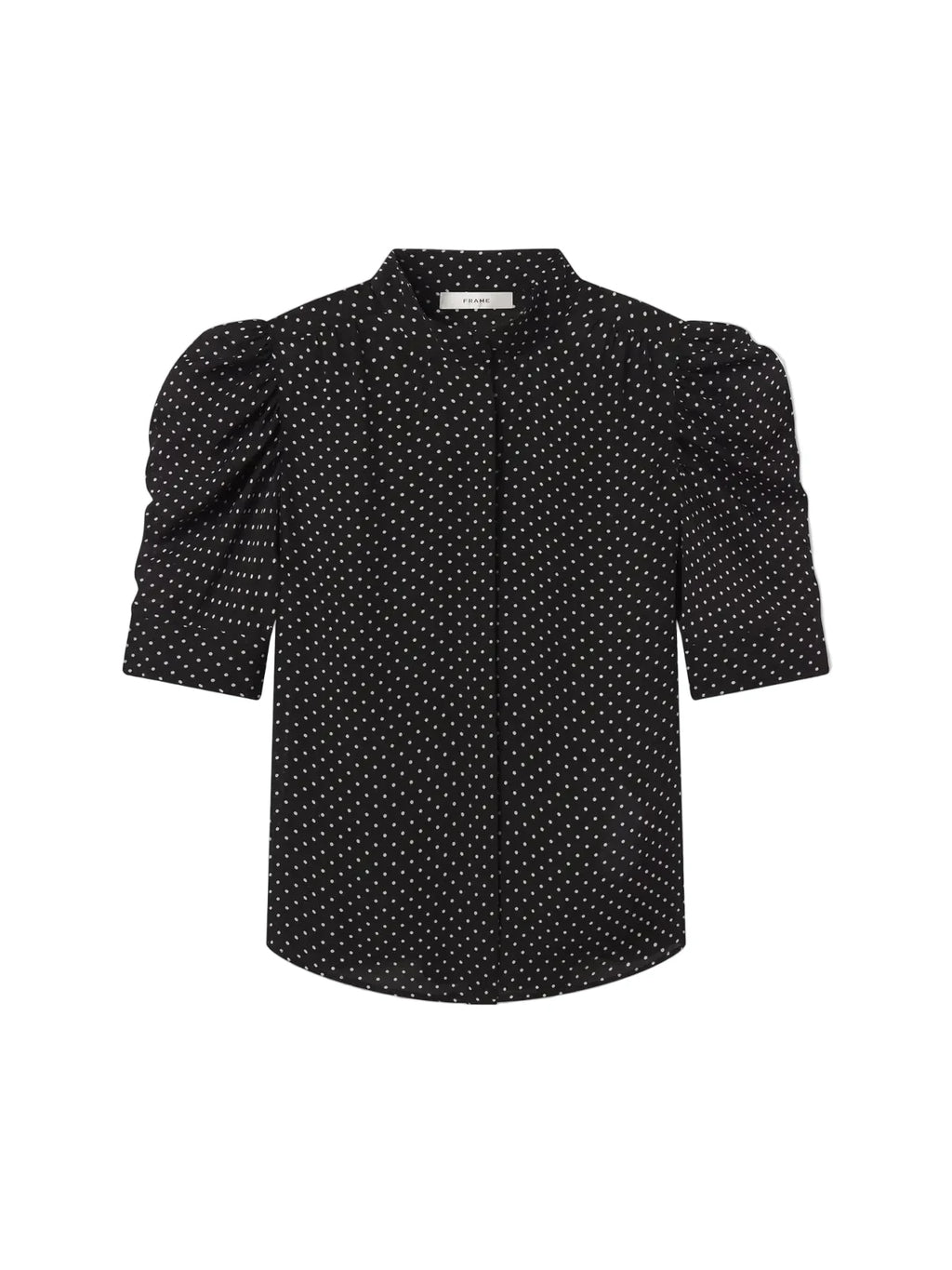 Black blouse with white polka dots on a light gray background. Gillian Top Blouse Frame brand