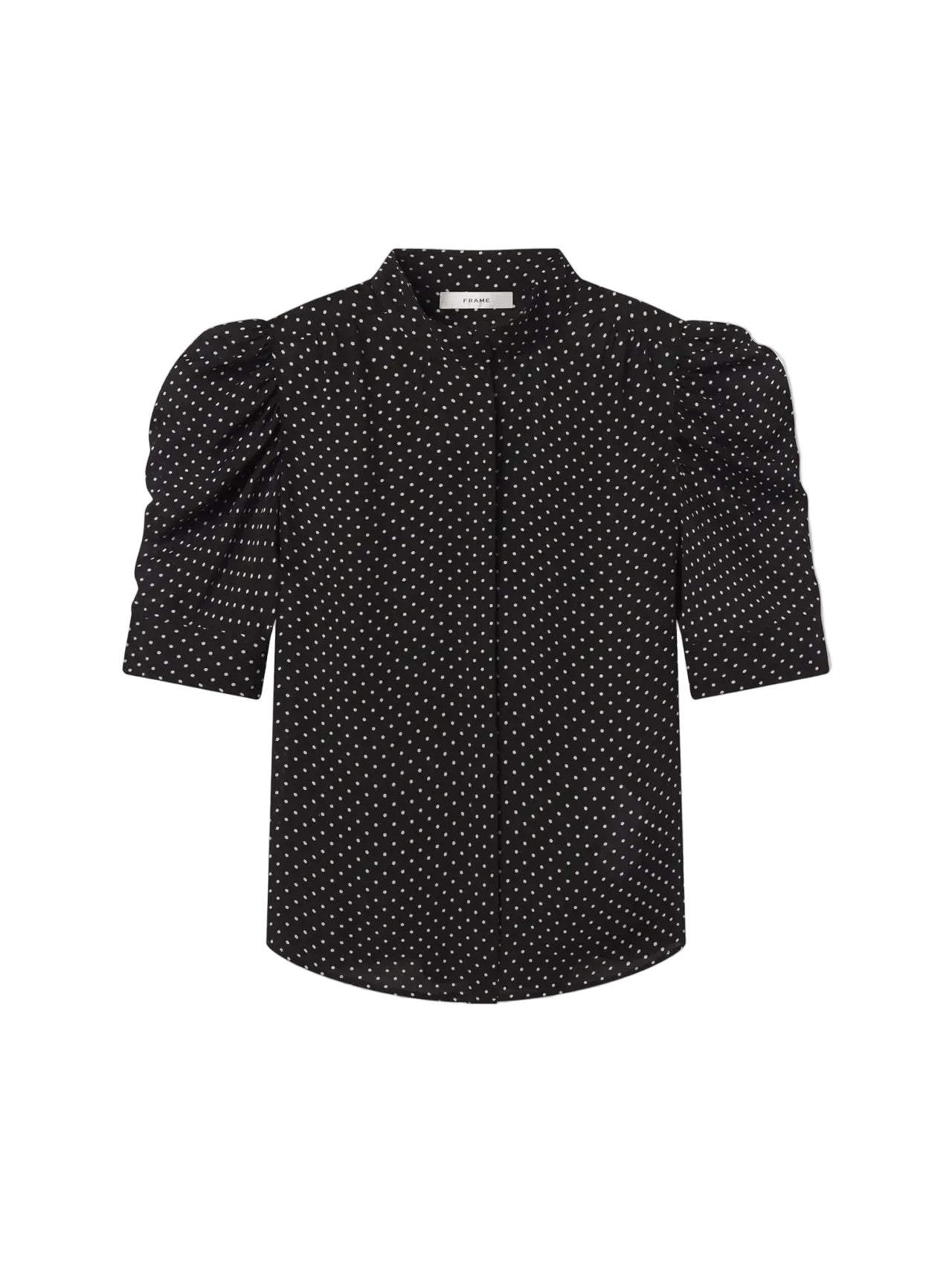 Black blouse with white polka dots on a light gray background. Gillian Top Blouse Frame brand