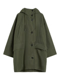 Green coat with button details on a white background