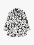 Black and white star-patterned shirt on a white background