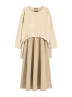 Beige dress with long sleeves on a white background