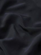 Close-up of dark blue fabric with visible texture