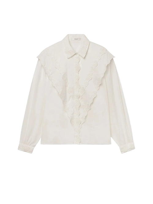 An off-white long-sleeve blouse with a wide, layered ruffled collar and a matching ruffled lace panel down the front, displayed on a clean white background.