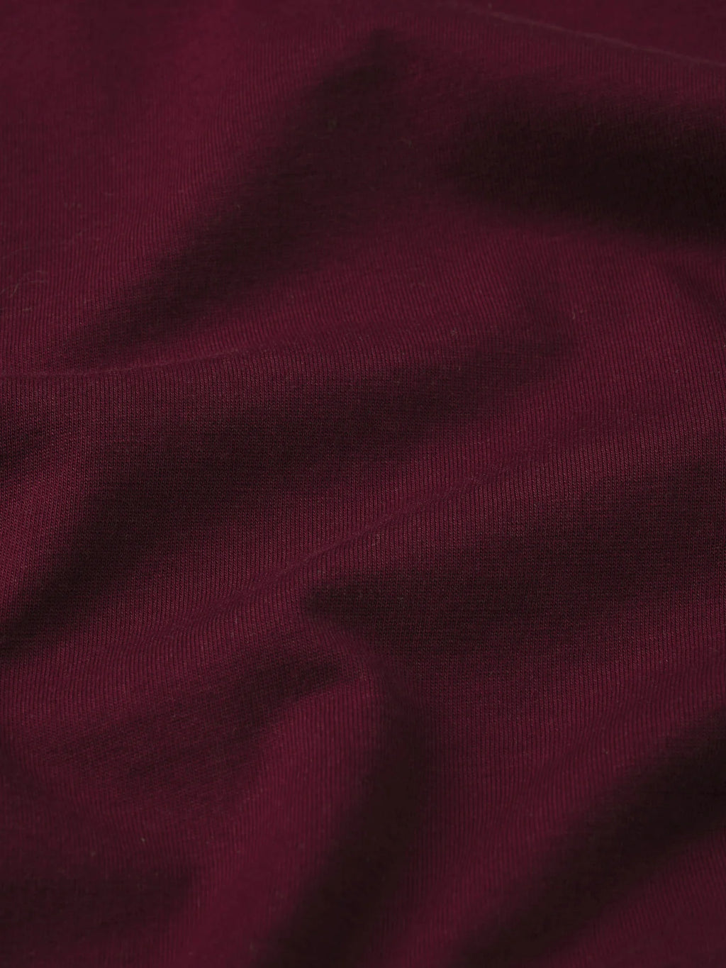 Close-up of dark purple fabric texture
