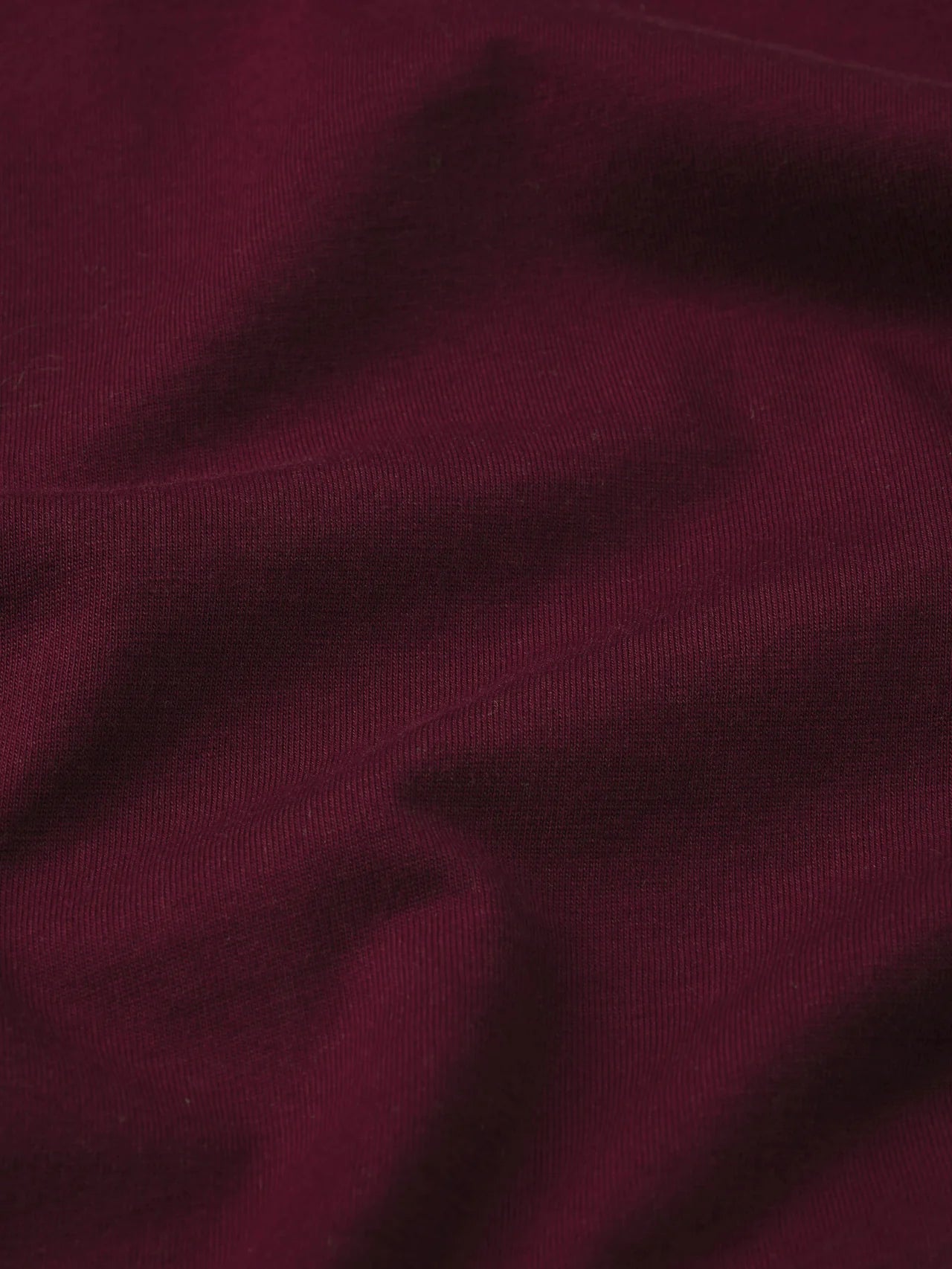 Close-up of dark purple fabric texture