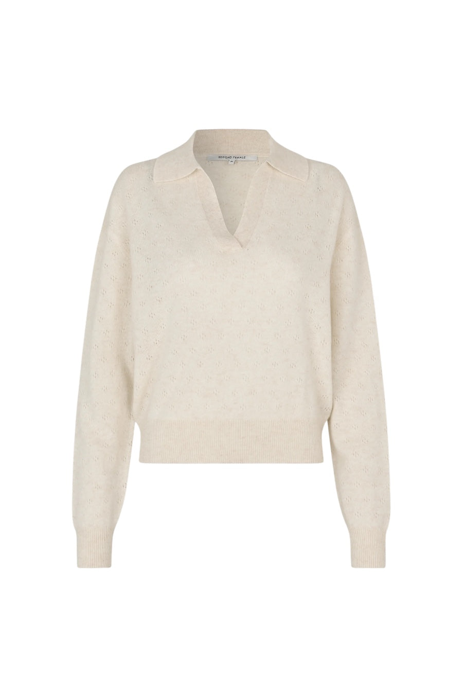 A light cream-colored knit polo sweater with a split V-neck collar, displayed on a clean white background.