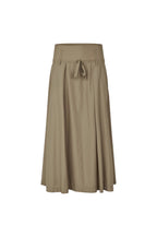 A high-waisted, mid-length pleated skirt in a solid taupe-brown color, featuring a tie detail at the front waistband, shown against a plain white background.