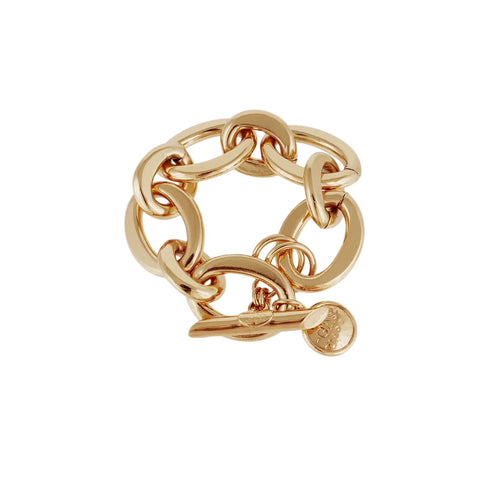 Gold chain bracelet with a heart charm on a white background