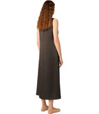 Woman wearing a brown sleeveless dress on a white background
