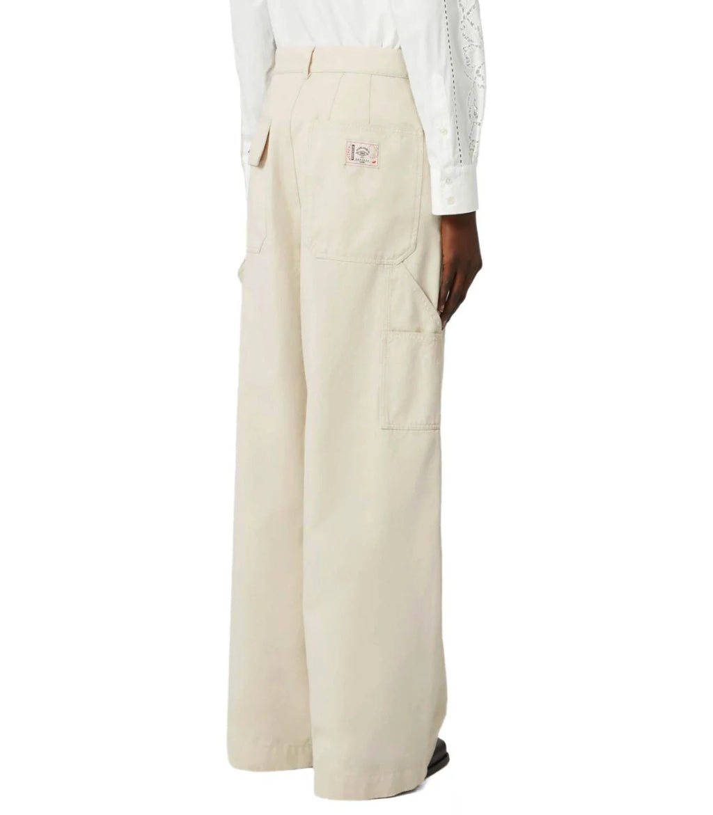 Beige wide-leg pants worn by a person on a white background