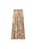 A pleated maxi skirt with an intricate paisley and floral pattern in beige, brown, and muted orange tones, shown against a plain white background.