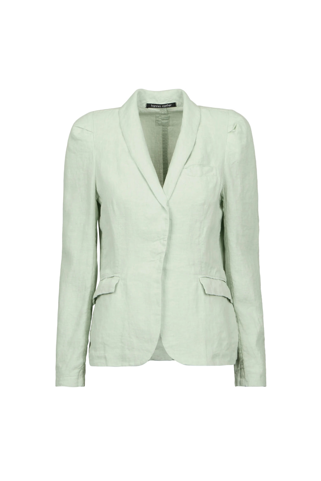 A light sage green tailored blazer by Hannes roether with a shawl collar, structured shoulders, and flap pockets, shown on a plain light blue background.