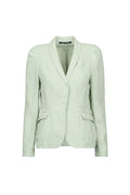 A light sage green tailored blazer by Hannes roether with a shawl collar, structured shoulders, and flap pockets, shown on a plain light blue background.
