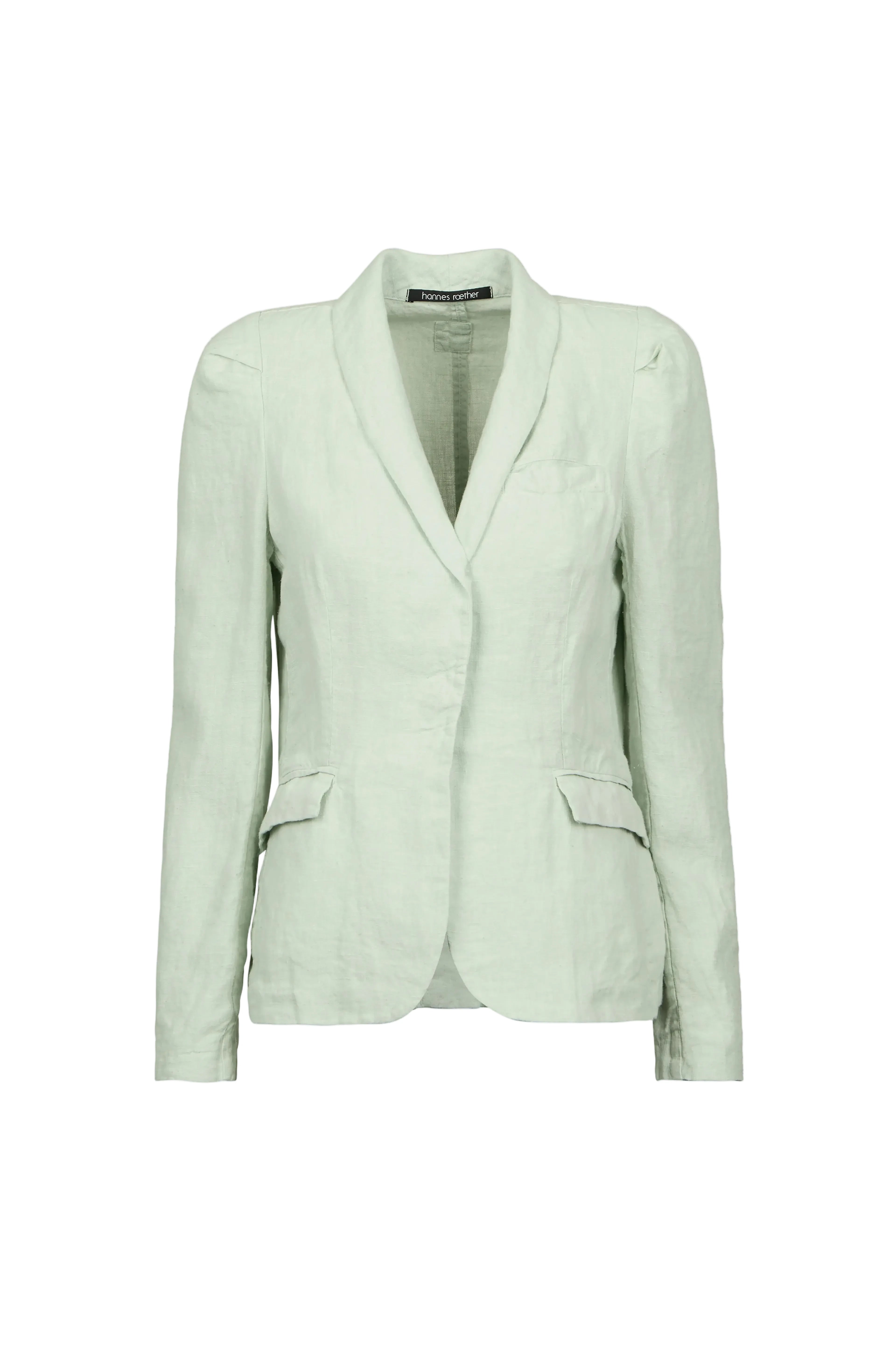 A light sage green tailored blazer by Hannes roether with a shawl collar, structured shoulders, and flap pockets, shown on a plain light blue background.