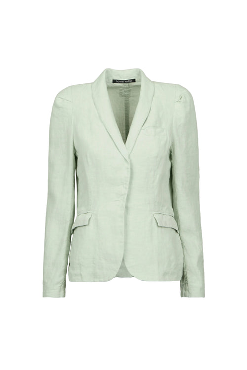 A light sage green tailored blazer by Hannes roether with a shawl collar, structured shoulders, and flap pockets, shown on a plain light blue background.