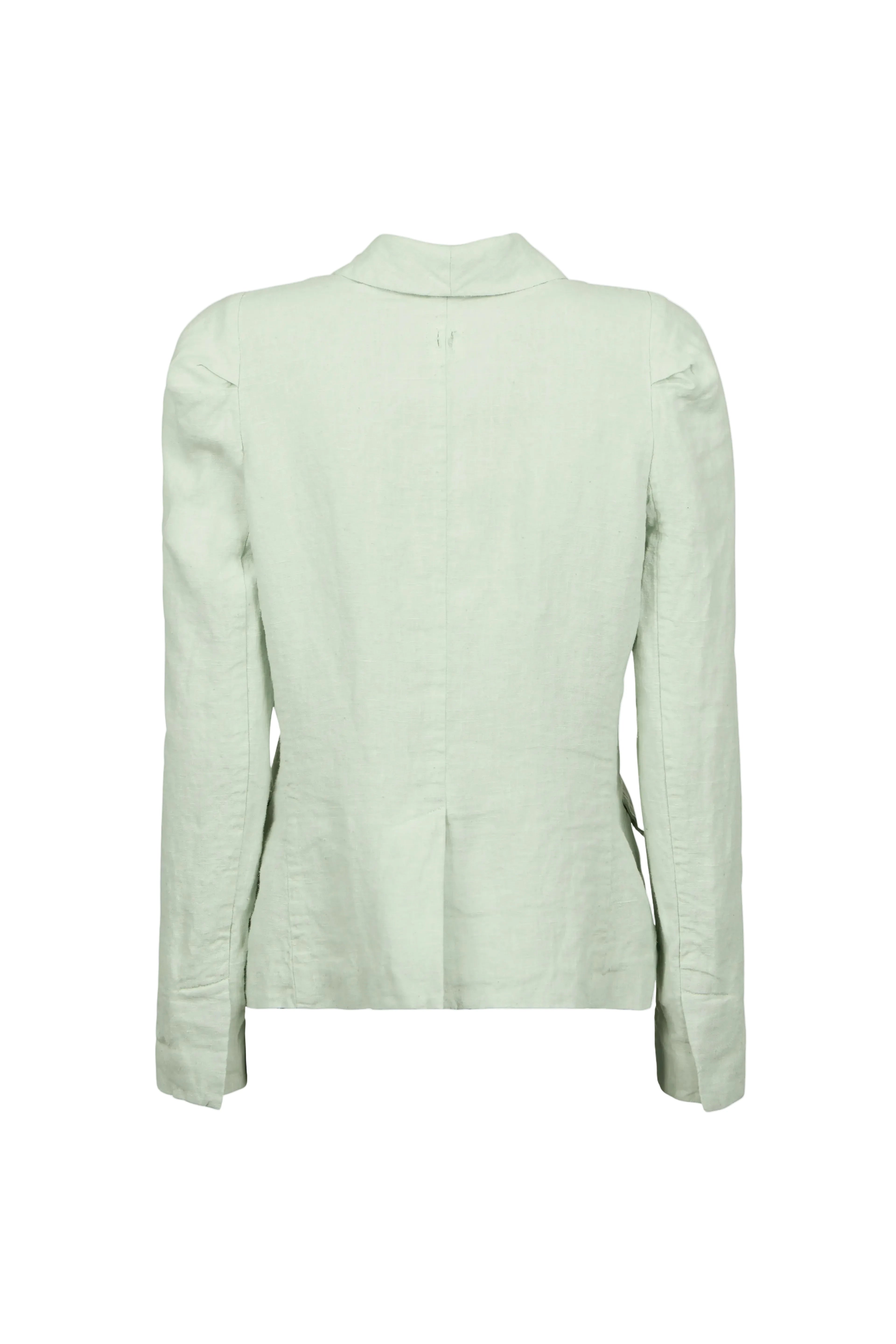 A light sage green linen jacket by Hannes Roether label shown from the back, featuring a high folded collar, long sleeves, and subtle shoulder detailing, displayed against a solid pale blue-gray background.
