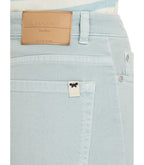 Light blue jeans with a visible brand label on a white background