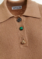 Close-up of a brown ribbed sweater with decorative buttons on a white background, featuring the 'Essentiel Antwerp' brand.