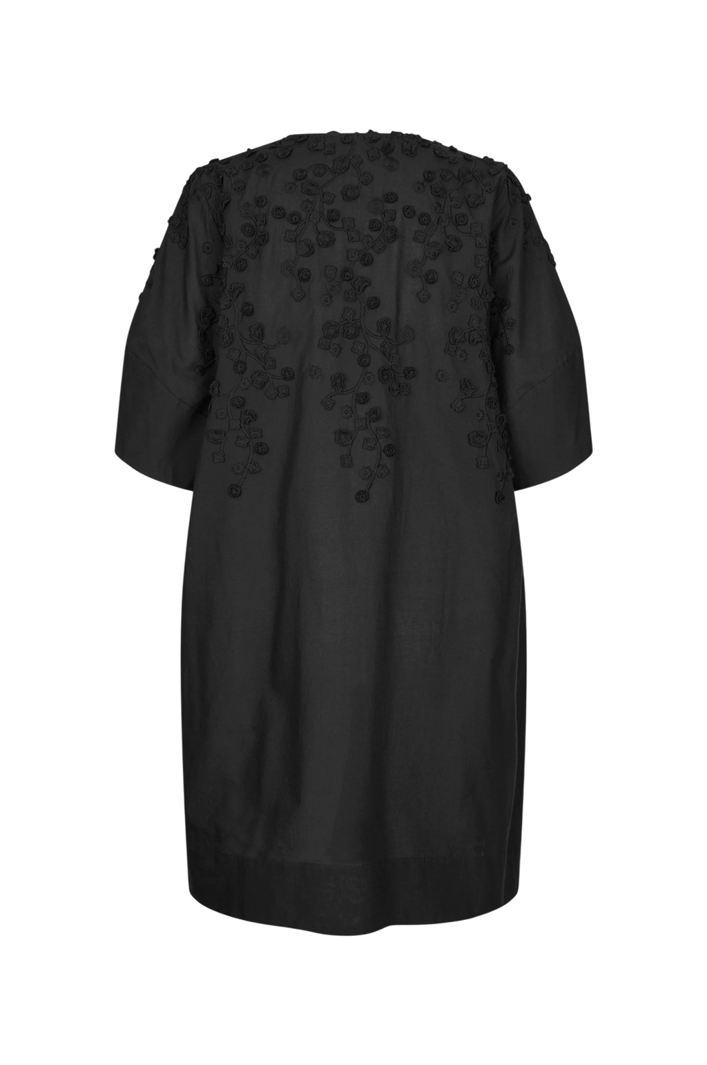 A black short-sleeve tunic dress with 3D floral applique detailing on the back, shown against a plain white background.
