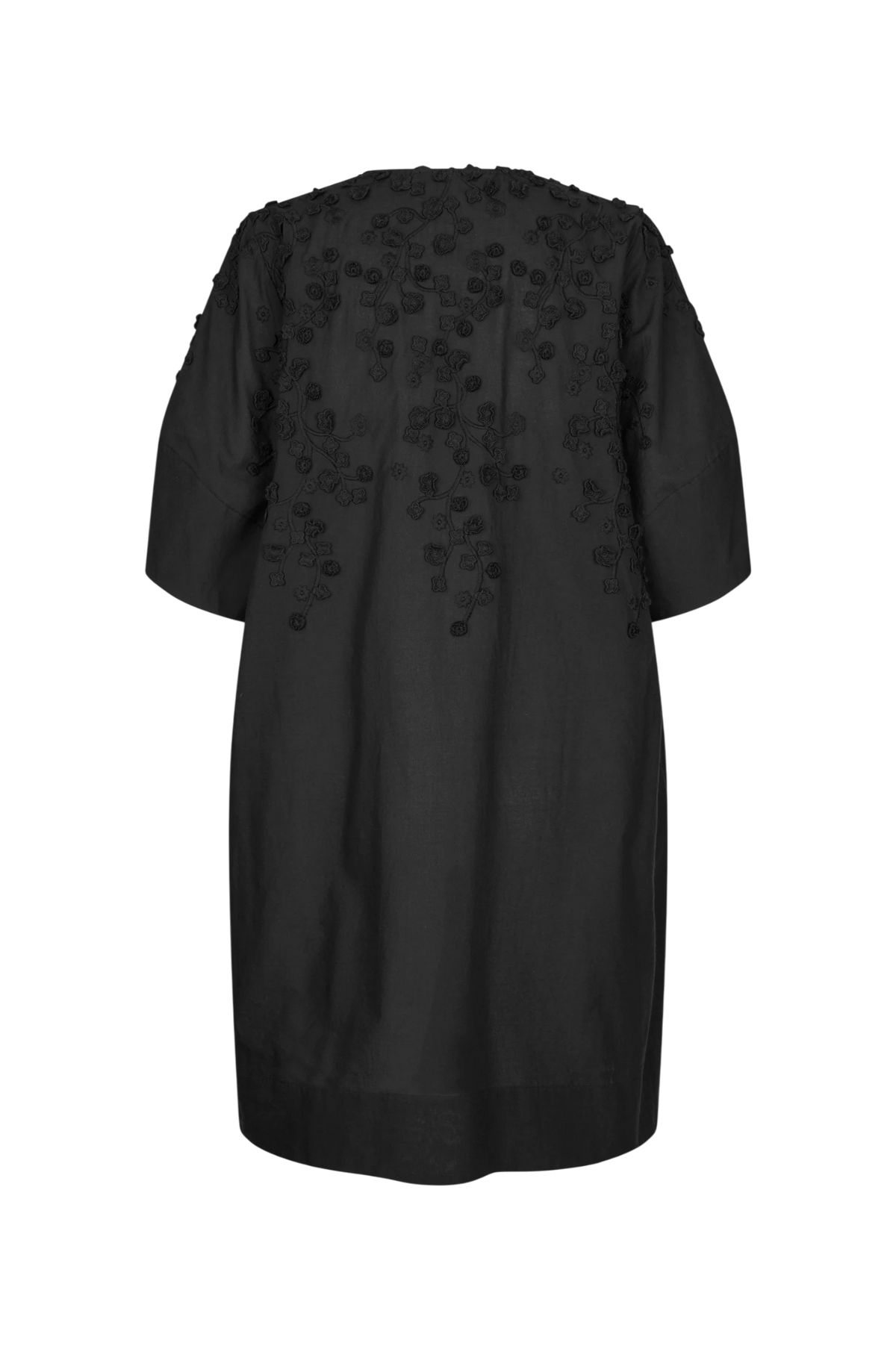 A black short-sleeve tunic dress with 3D floral applique detailing on the back, shown against a plain white background.