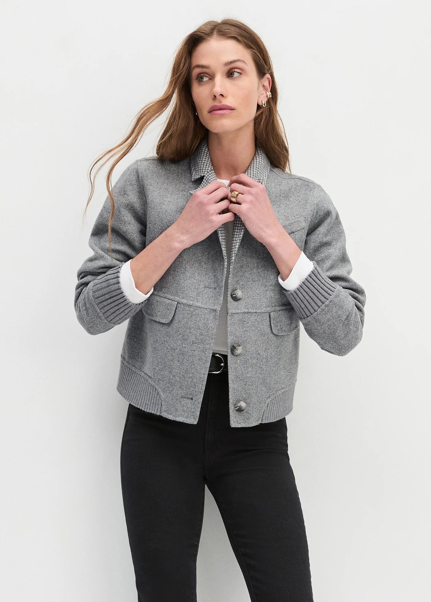 women satning in front of a white background wearing a bomber jacket the city bomber from favourite daughter 