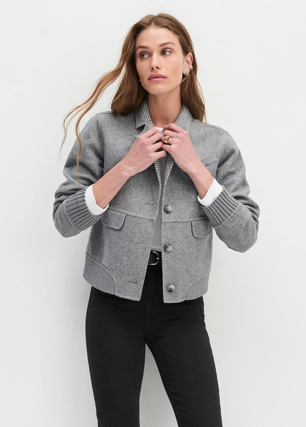 women satning in front of a white background wearing a bomber jacket the city bomber from favourite daughter 