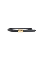 Black belt with gold buckle on a white background