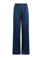 A pair of wide-leg trousers in a deep navy blue satin fabric, shown against a solid light beige background.
