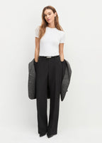 women wearing the penny tee  white t-shirt from favourite daughter standing in front of a white background 