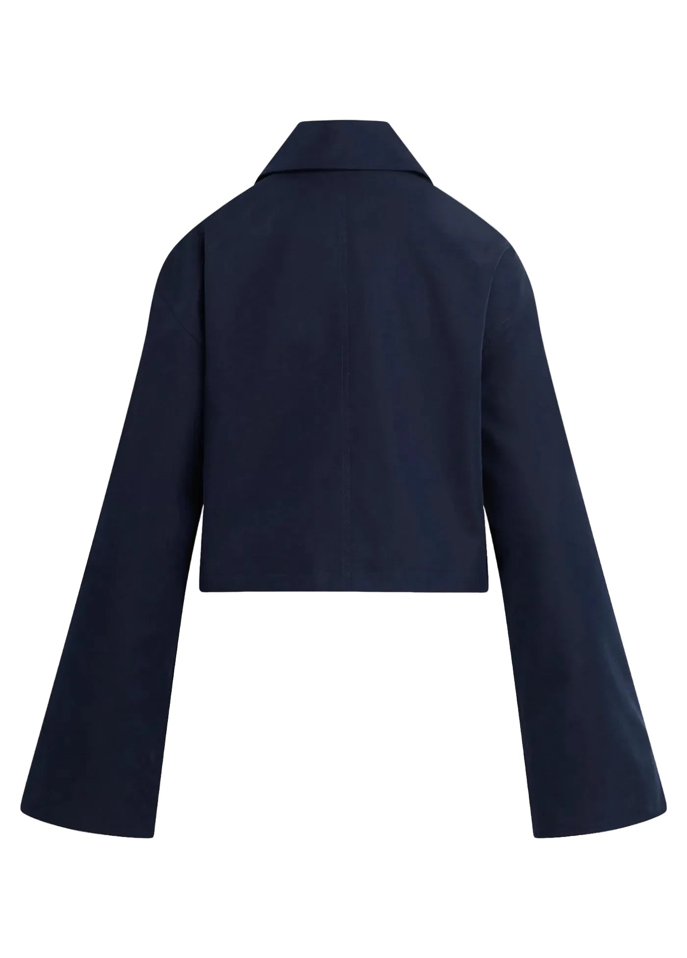 A cropped navy blue blazer with long wide sleeves, shown from the back against a solid light beige background.