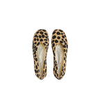A pair of pointed-toe flat shoes with a tan and black leopard print pattern, shown from a top-down view on a light gray background.