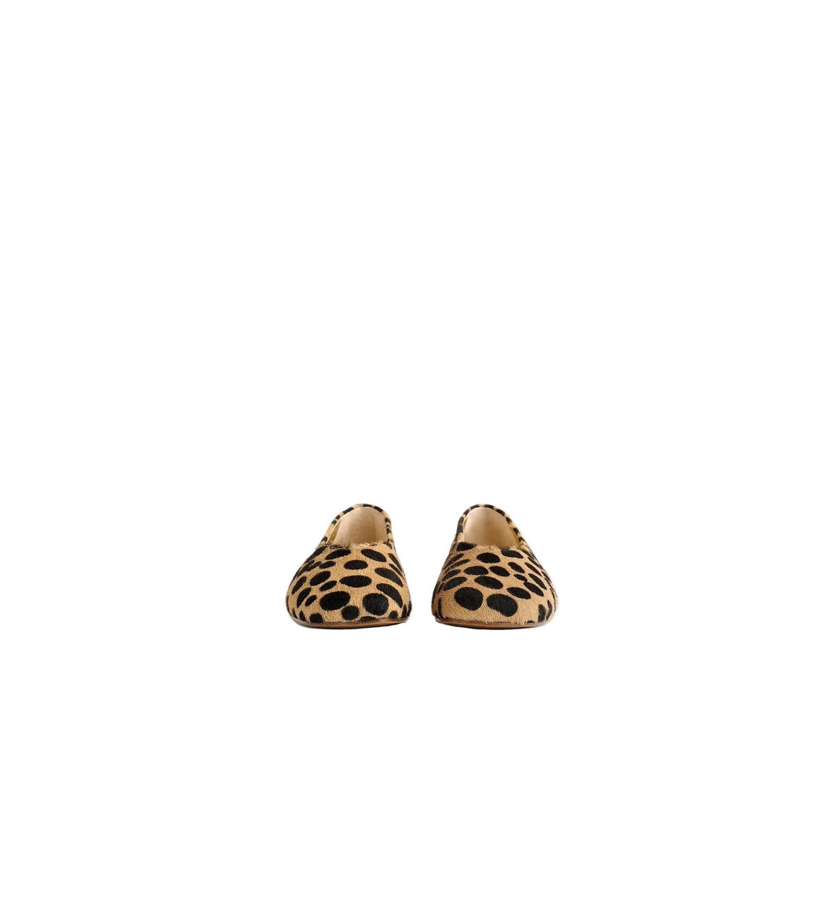 A pair of slip-on loafers with a tan and black leopard print pattern, shown from the front on a light gray background.