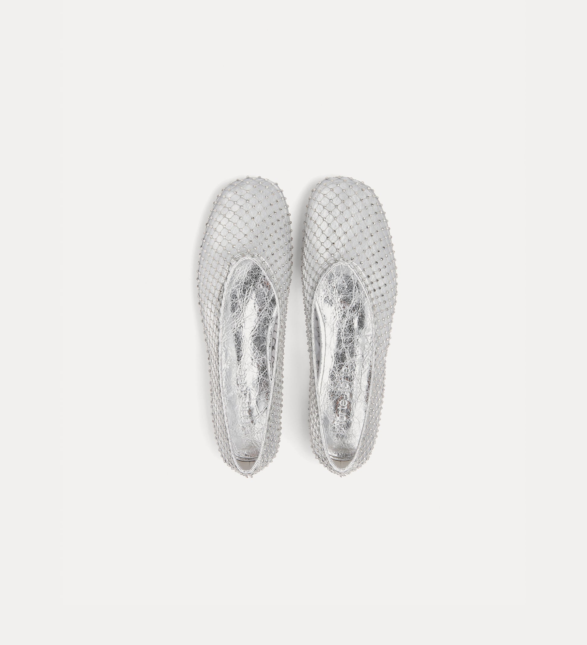 Pair of silver hoop earrings on a light gray background