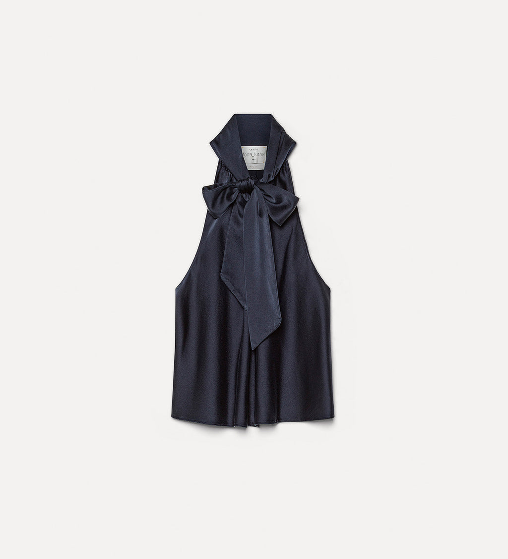 Navy blue sleeveless top with a bow detail on a light gray background
