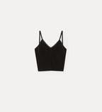Black crop top with thin straps on a white background