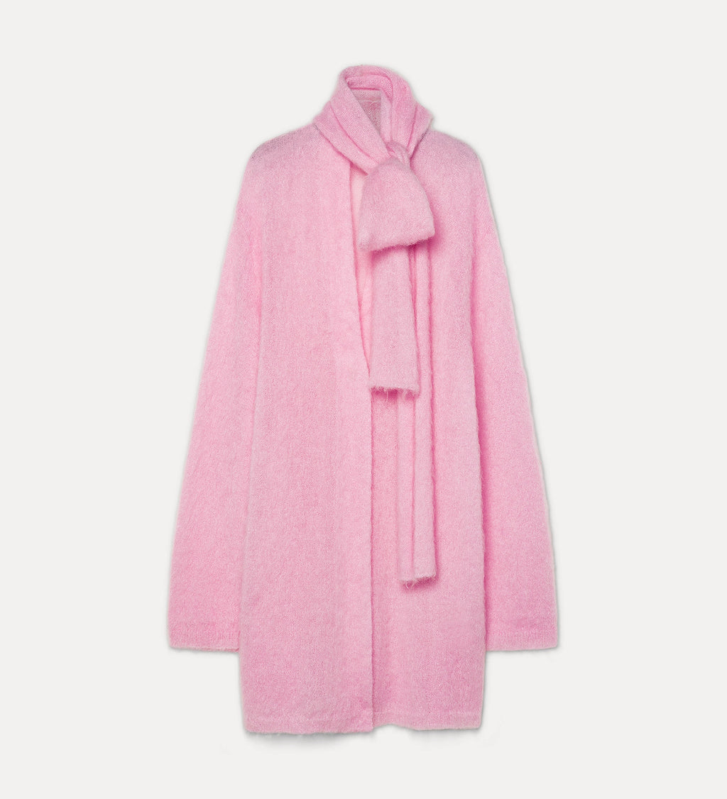 Pink coat with a matching scarf on a light gray background