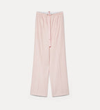 Light pink pajama pants on a white background