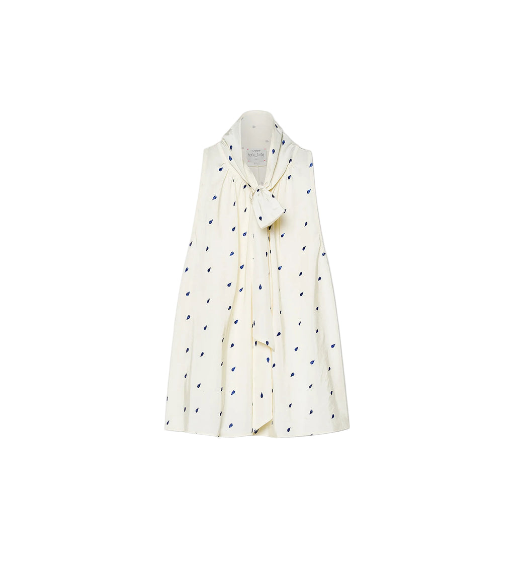 White shirt with black polka dot pattern on a white background