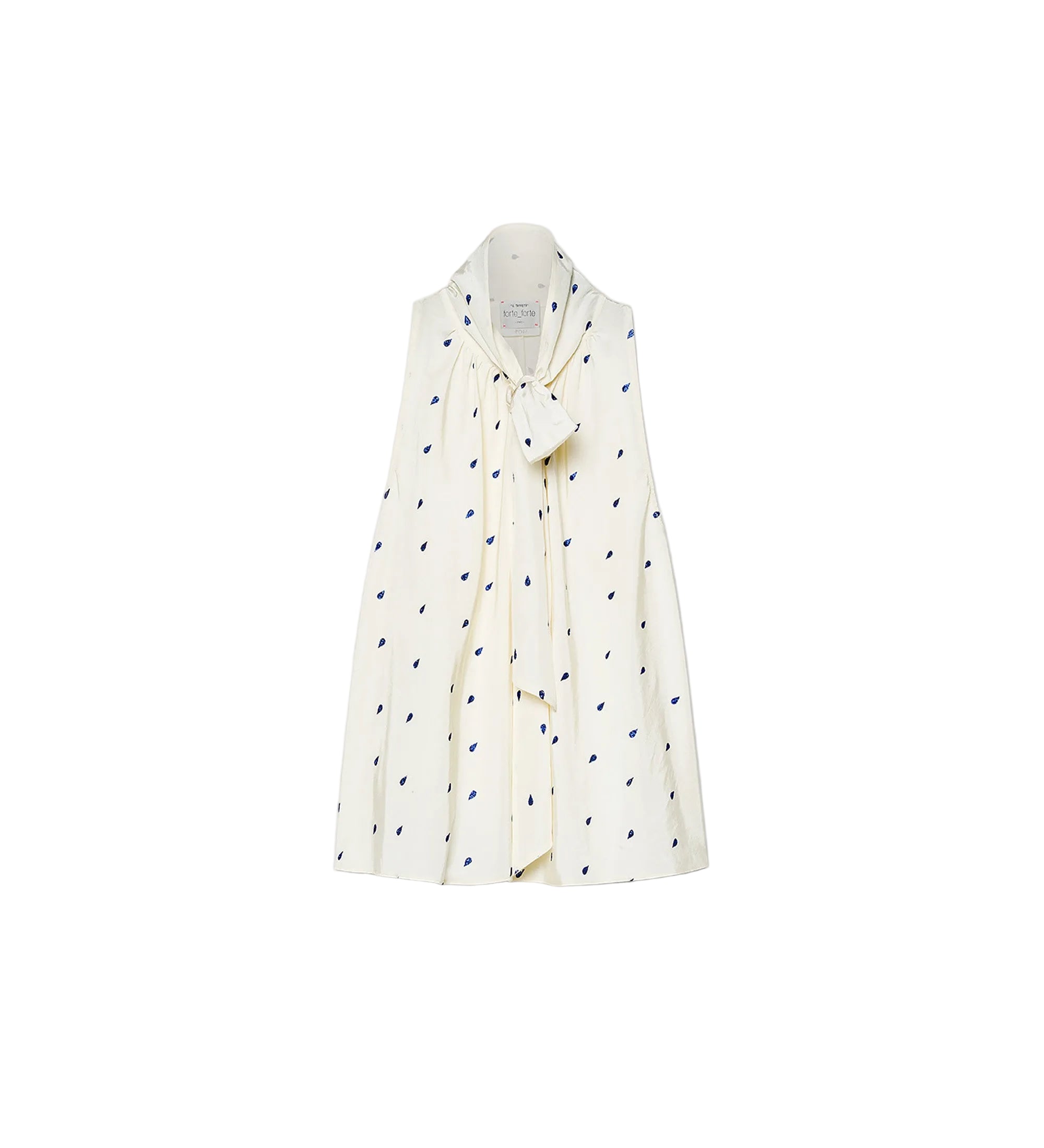 White shirt with black polka dot pattern on a white background