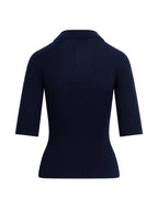 A dark navy blue ribbed knit top with three-quarter sleeves and a collar, shown from the back on a light beige background.