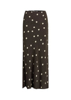 Black skirt with white polka dots on a white background